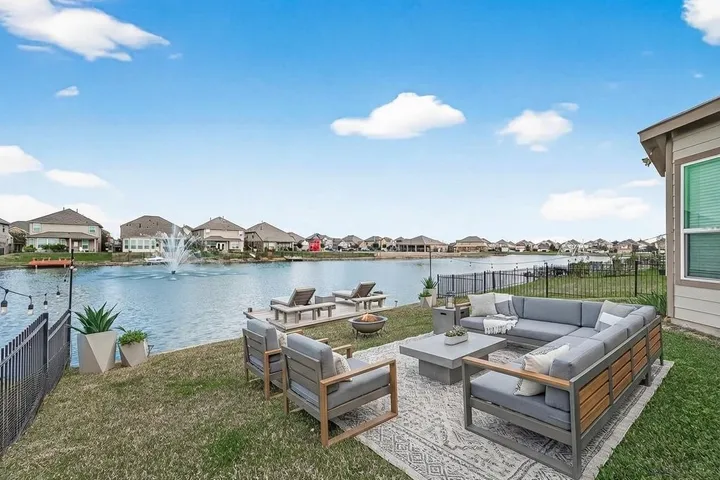 Lakeside backyard with an outdoor lounge on Scarlatti Cantata Dr